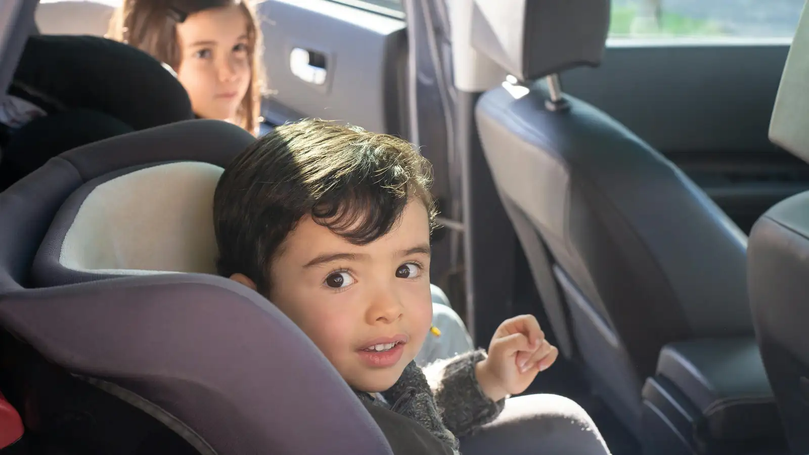 Baby sleeping in a convertible car seat